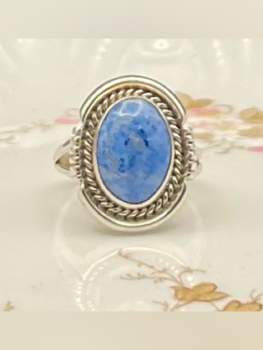 Navajo SS blue lapis halo stone set in a classic rope-textured silver bezel